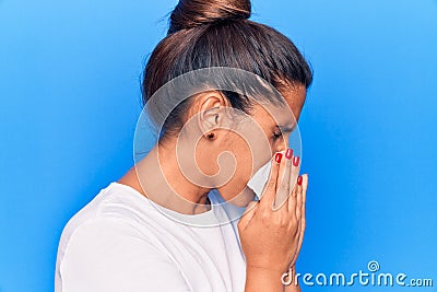 Young latin woman illness using paper handkerchief on nose Stock Photo