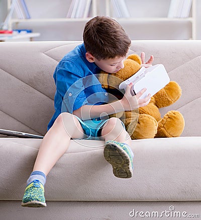 Young little boy with VR virtual reality glasses Stock Photo