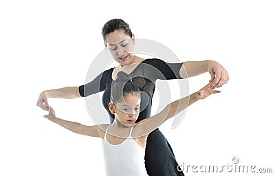Young little girl ballerina learning dance lesson with ballet teacher Stock Photo