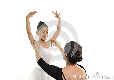 Young little girl ballerina learning dance lesson with ballet teacher Stock Photo