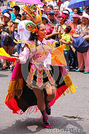 Young local woman performing during Festival of the Virgin de la Editorial Stock Photo