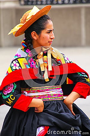 Young local woman performing suring Festival of the Virgin de la Editorial Stock Photo