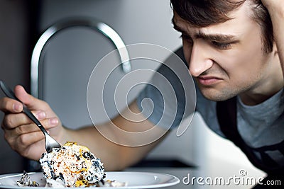 Loser bachelor on modern kitchen concept Stock Photo