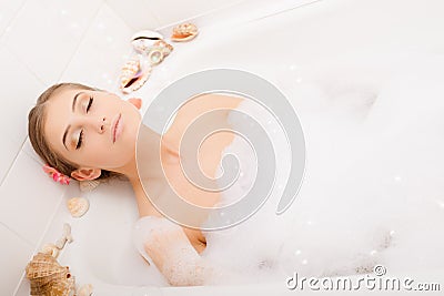 Young lovely woman in foam bath Stock Photo