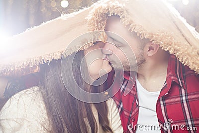 Young lovers man and the woman hid under a soft blanket. Stock Photo