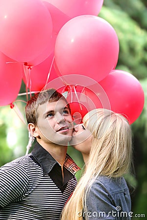 Young loving couple on natural background Stock Photo