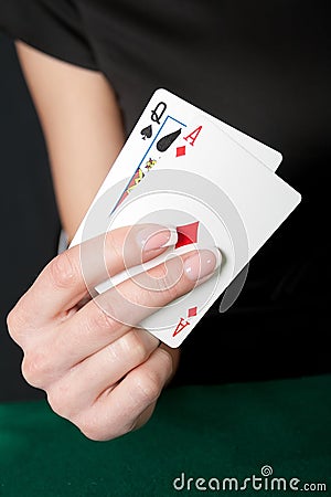 Young lucky gambler with cards Stock Photo