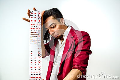 Young magician disappointed that his trick with a deck of cards has not gone well Stock Photo