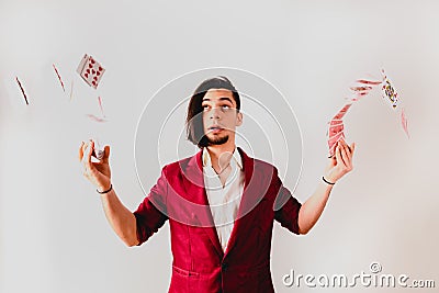 Young magician juggling a deck of playing cards Stock Photo
