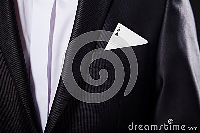 Young magician showing tricks using cards from deck. Close up. Stock Photo