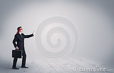 Businessman with blindfolds Stock Photo