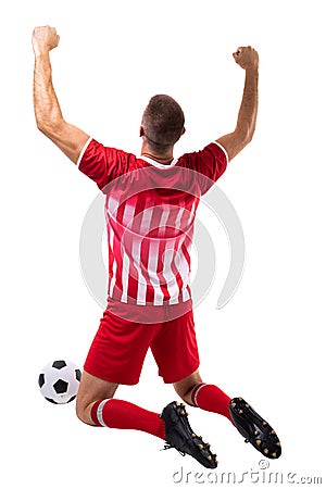 Young male caucasian athlete celebrating while kneeling by soccer ball over white background Stock Photo