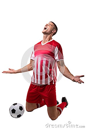 Young male caucasian soccer player celebrating goal by ball against white background Stock Photo
