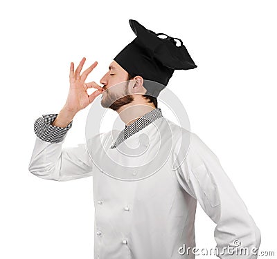 Young male chef showing perfect taste sign Stock Photo