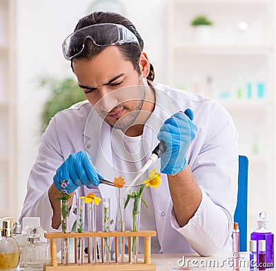 Young male chemist in perfume synthesis concept Stock Photo