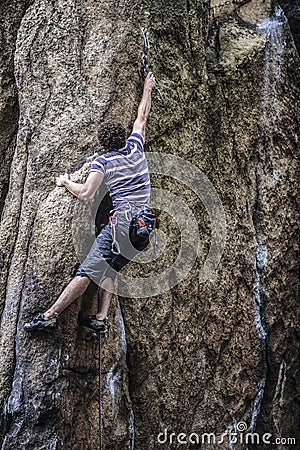 Young male climber leading a route on a rock. Sokoliki, Poland. Editorial Stock Photo