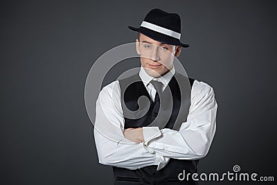 Young male confident male posing in gangster style suite. Stock Photo