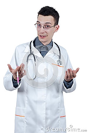Young male doctor with glasses gesturing and looking at the camera. Stock Photo