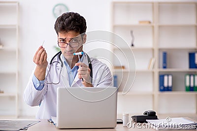 Young male doctor neurologist working in the clinic Stock Photo
