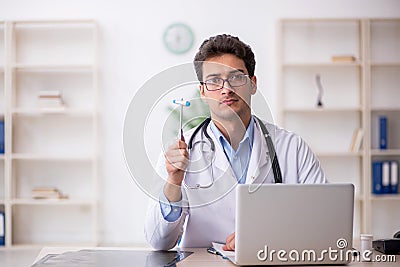 Young male doctor neurologist working in the clinic Stock Photo