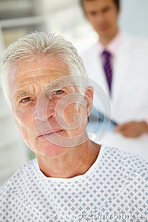 Young male doctor with senior patient Stock Photo