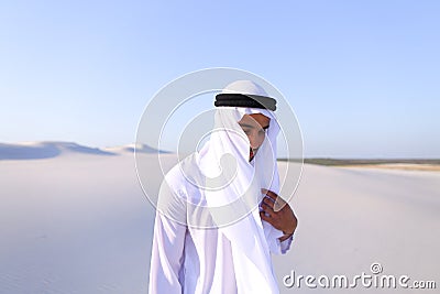 Young male emirate rejoices in life and walks through expanses o Stock Photo