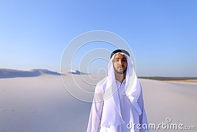 Young male emirate rejoices in life and walks through expanses o Stock Photo