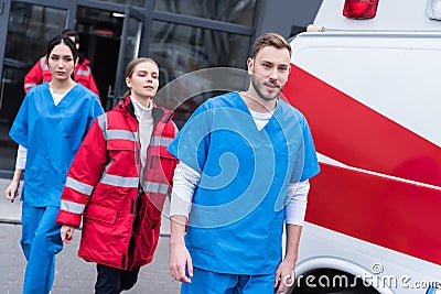 young male and female paramedics walking Stock Photo