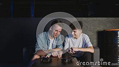 Young male friends discussing strategy plan to next game session Stock Photo