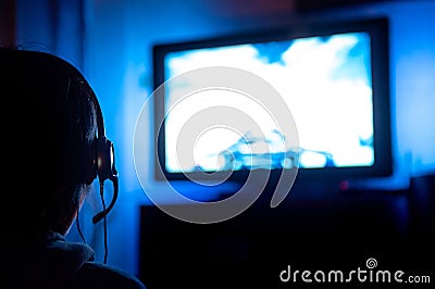 Young male gamer playing video game at home Stock Photo