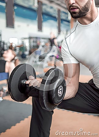 Young male performing TRX training at the gym Stock Photo