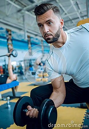 Young male performing TRX training at the gym Stock Photo