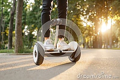 Young male person riding on gyroboard in park Stock Photo