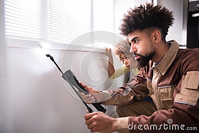 Pest Control Worker Using Torch While Spraying Insecticide Stock Photo