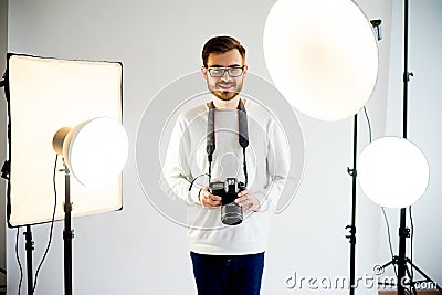 Young male photographer in studio Stock Photo