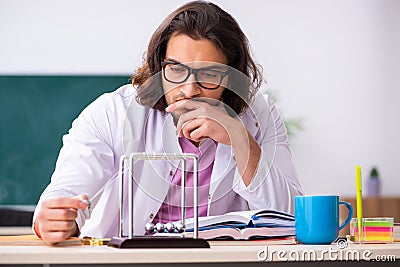 Young male physicist in the classroom Stock Photo