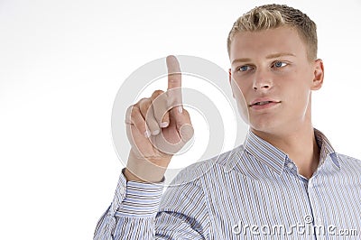 Young male pointing upward Stock Photo