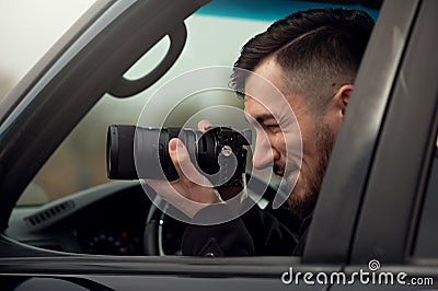 Close-up - Young Man Photorapher Sitting In The Car Stock Photo