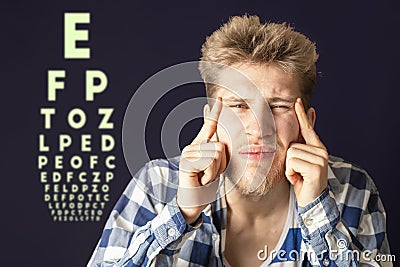 Young male test eye vision and cover eye with hand b Stock Photo