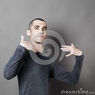 Young man accusing himself or for dynamic self-esteem Stock Photo