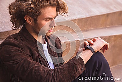 Young man with activity tracker. Smart sport device Stock Photo