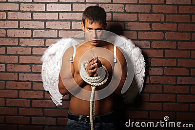 Young man with angel wings. Stock Photo