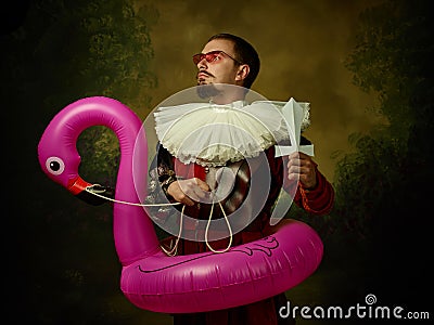 Young man as a medieval knight on dark background Stock Photo