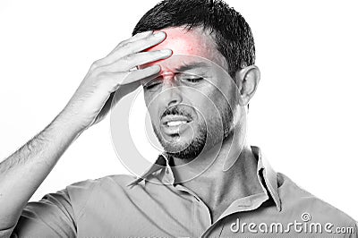 Young Man with Beard suffering Headache and migraine in pain expression Stock Photo