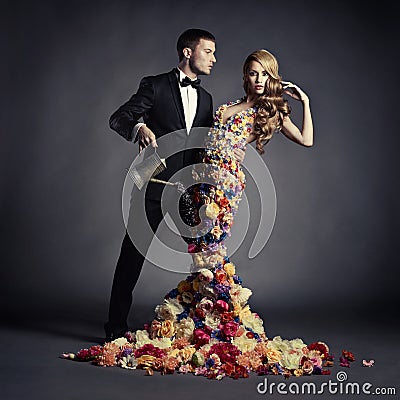 Young man and beautiful lady in flower dress Stock Photo