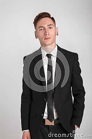 Young man in a black suit Stock Photo