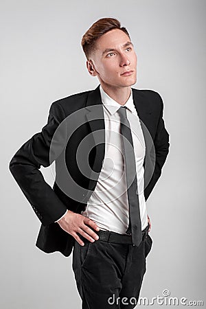 Young man in a black suit Stock Photo