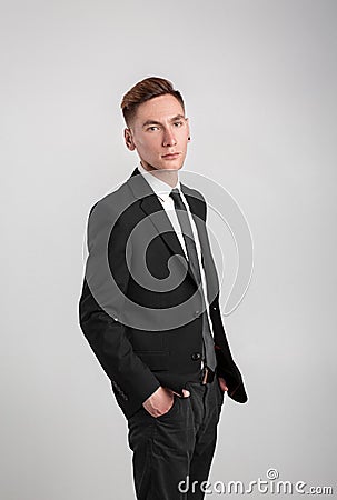 Young man in a black suit Stock Photo