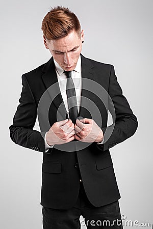 Young man in a black suit Stock Photo