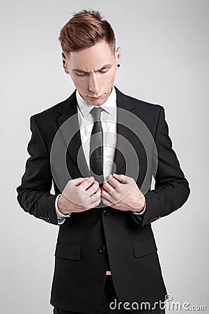 Young man in a black suit Stock Photo